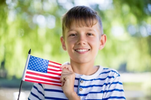 portrait-boy-holding-american-flag_107420-52693.jpg